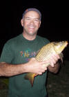 Thierry Fuchslock with a 2kg Common Carp