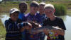 Excited Youngsters with a small Barbel (Sharptooth Catfish)