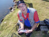 Small Rainbow Trout caught on an Orange Woolly Bugger